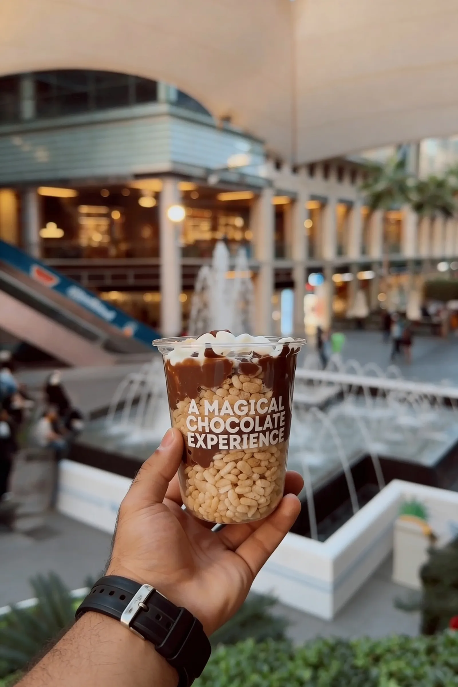 Hand holding a ChocolateBar iced drink
